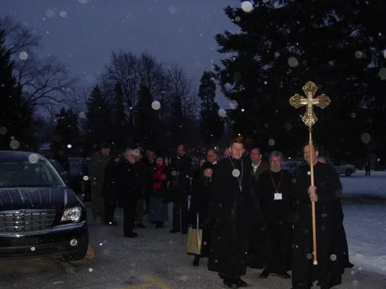 The procession waiting outdoors in the cold for the bishops to arrive